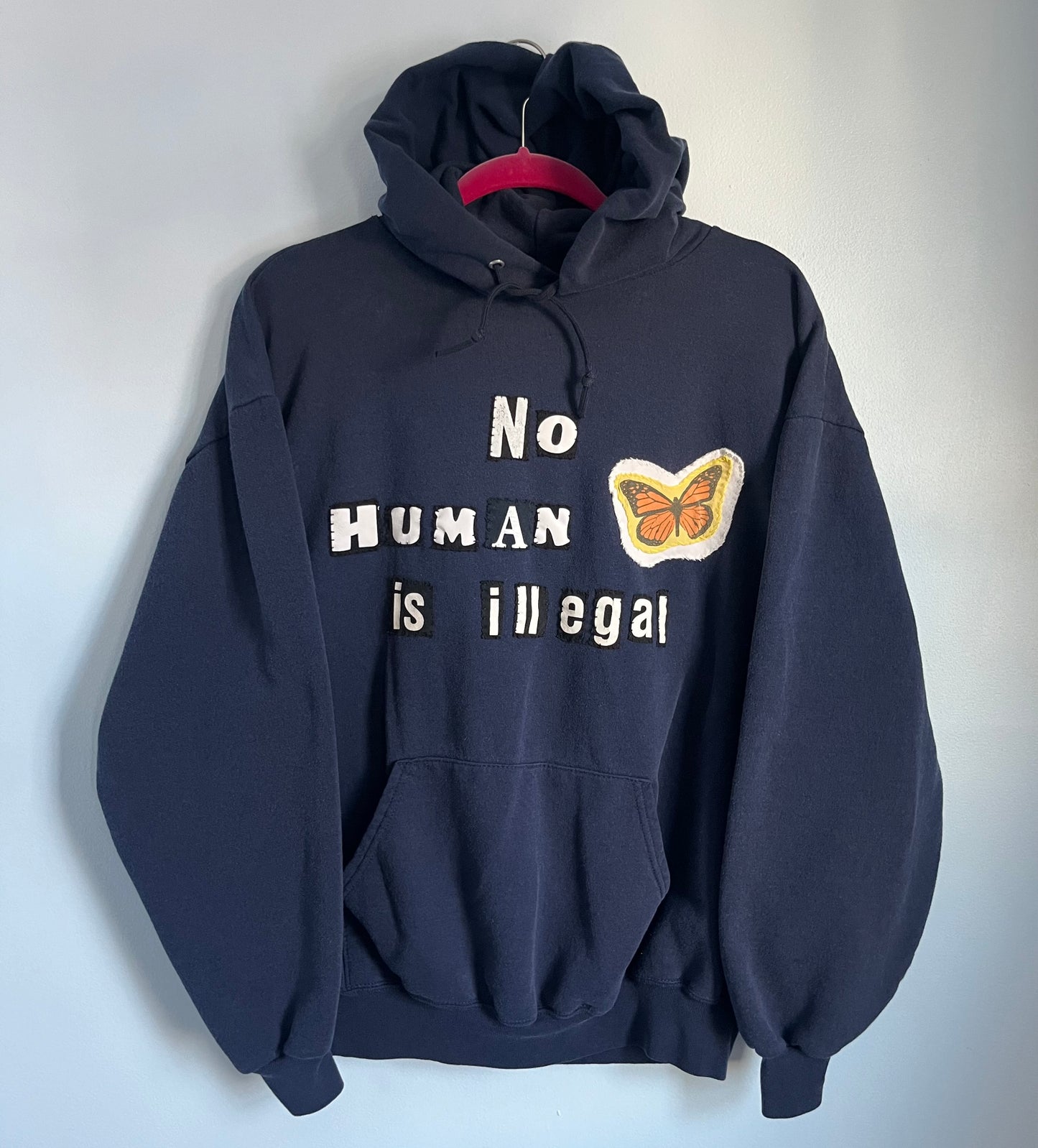 NO HUMAN IS ILLEGAL Hoodie | XL