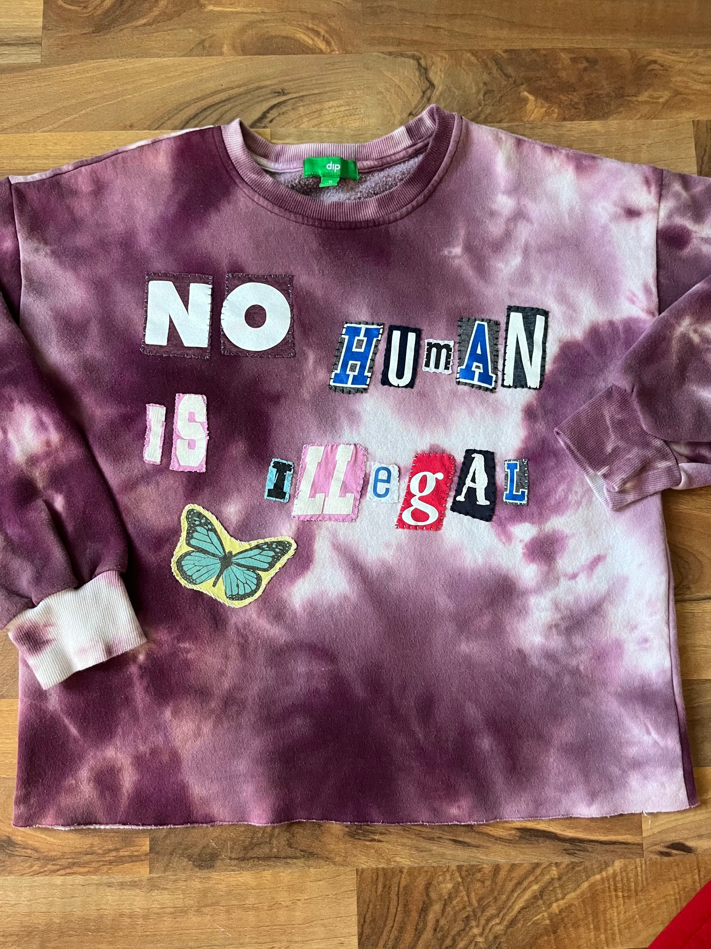 NO HUMAN IS ILLEGAL | M