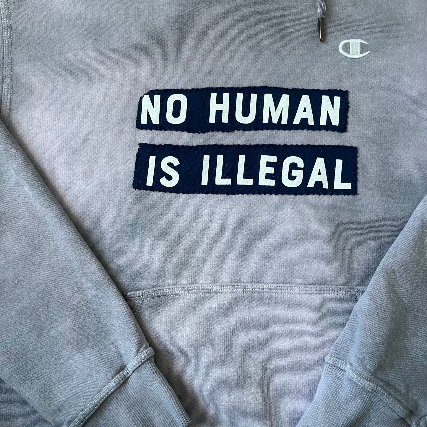NO HUMAN IS ILLEGAL Purple Dyed Hoodie | L