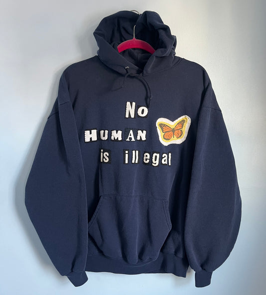 NO HUMAN IS ILLEGAL Hoodie | XL