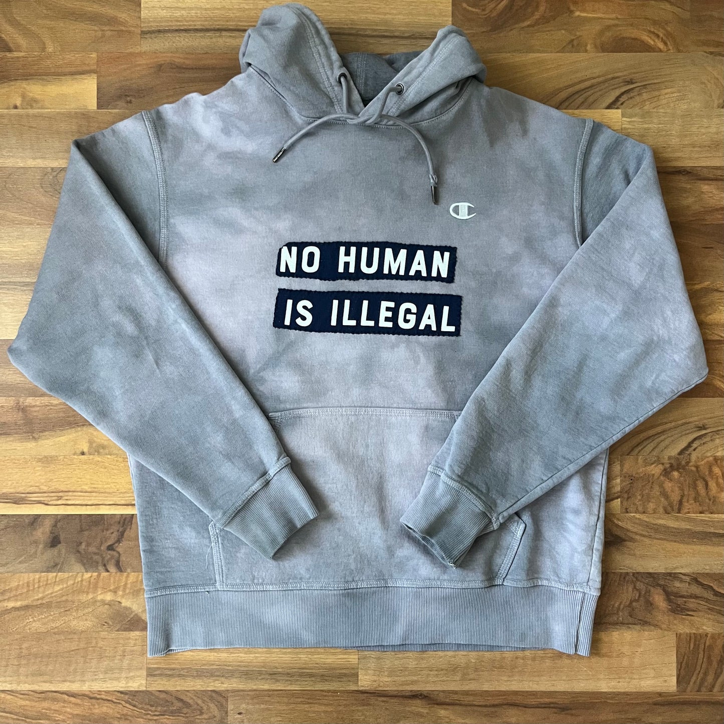 NO HUMAN IS ILLEGAL Purple Dyed Hoodie | L